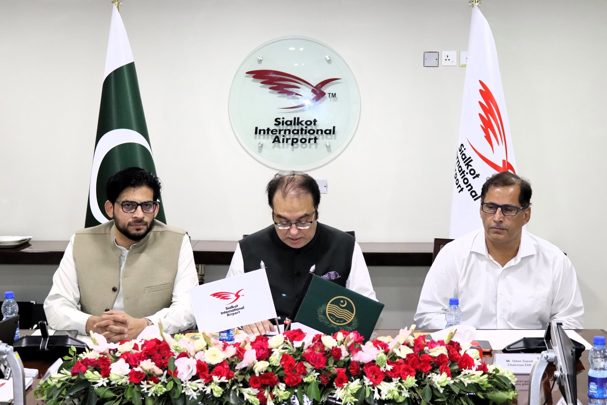 Chairman EDF Mr. Omer Saeed and Chairman SIAL Mr. Hassan Ali Bhatti at the signing table, Sialkot International Airport.